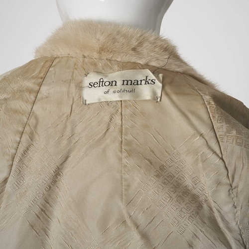 554 - Sefton Marks, a palomino mink jacket, featuring a notched lapel collar, hook and eye fastenings, two... 