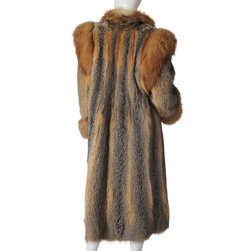 559 - Philip Hockley, a coyote wolf fur coat, designed with red fox fur trim, hook and eye fastenings and ... 