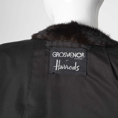 561 - Grosvenor Harrods, a full-length dark ranch mink coat, featuring a Mandarin collar with removable mi... 