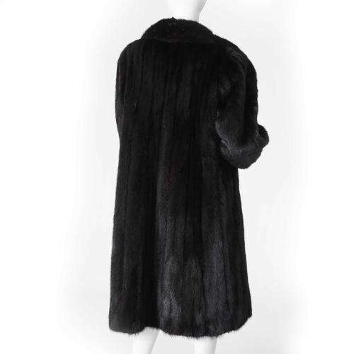 564 - A full-length dark ranch mink coat, fully stranded, featuring a notched lapel collar, hook and eye f... 