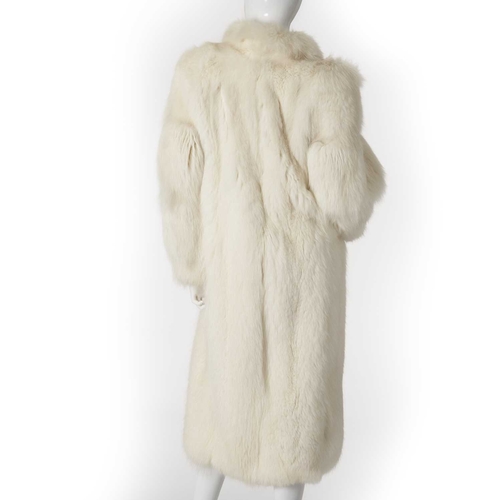 566 - A full-length Arctic fox fur coat, featuring a short lapel collar, hook and eye clip fastenings and ... 