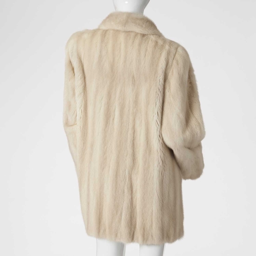 567 - Siberian Fur Store, a three-quarter length azurene mink coat, featuring a lapel collar, hook and eye... 