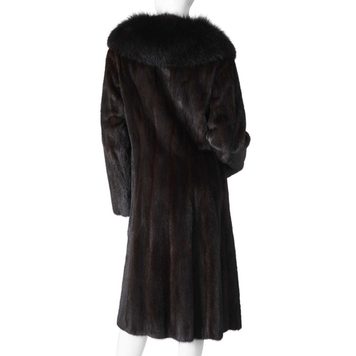 568 - A dark ranch mink coat with fox fur collar, fully stranded, with a dyed fox fur lapel collar, hook a... 