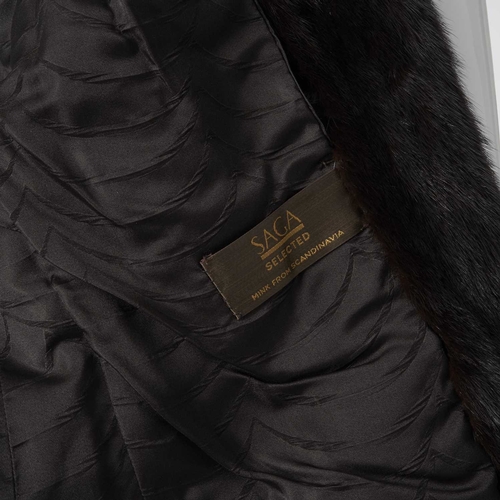 578 - Saga, a dark ranch mink jacket, featuring a lapel collar, hook and eye clip fastenings, two outer po... 