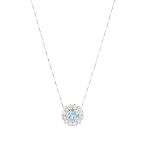 73 - An aquamarine and diamond cluster pendant, with 18ct gold trace-link chain, aquamarine estimated wei... 