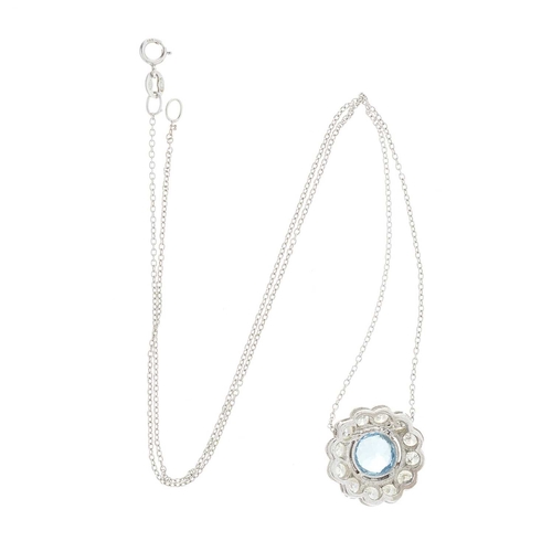 73 - An aquamarine and diamond cluster pendant, with 18ct gold trace-link chain, aquamarine estimated wei... 