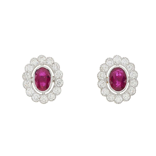 76 - A pair of 18ct gold ruby and brilliant-cut diamond cluster earrings, estimated total ruby weight 1.2... 