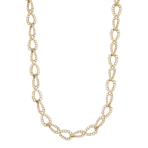 83 - A 1980s 18ct gold diamond necklace, designed as a series of brilliant-cut diamond interlocking links... 