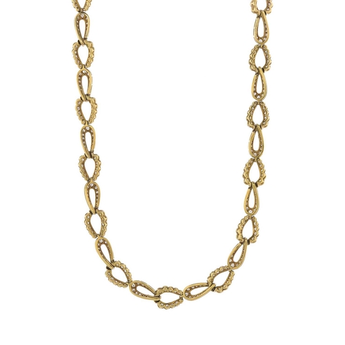 83 - A 1980s 18ct gold diamond necklace, designed as a series of brilliant-cut diamond interlocking links... 