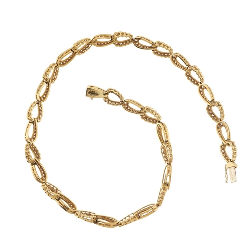 83 - A 1980s 18ct gold diamond necklace, designed as a series of brilliant-cut diamond interlocking links... 