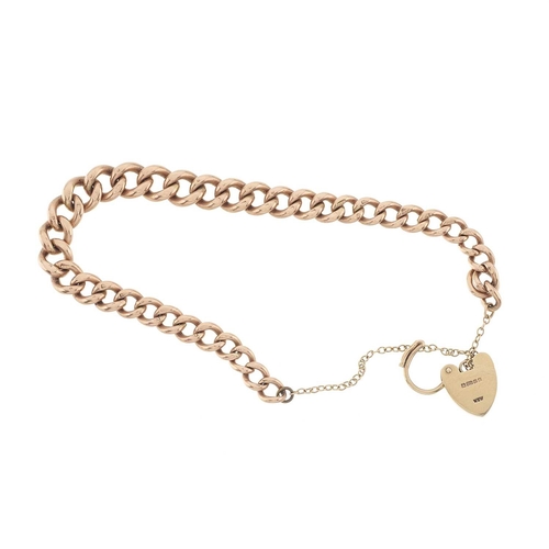 9 - An early 20th century 9ct gold graduated curb-link bracelet, with later 9ct gold heart-shape padlock... 