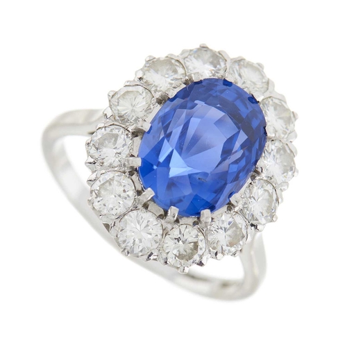 92 - An 18ct gold and platinum, Sri Lankan sapphire and brilliant-cut diamond cluster ring, with photocop... 