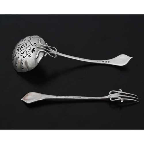 100 - An Arts and Crafts silver pickle fork and caster spoon, Levi and Salaman, Birmingham 1903/1904, poin... 