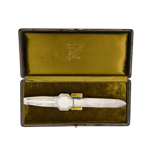 127 - Lucien Georges Bazor, an Art Deco silvered bronze letter knife, Paris 1928, the handle cast in relie... 