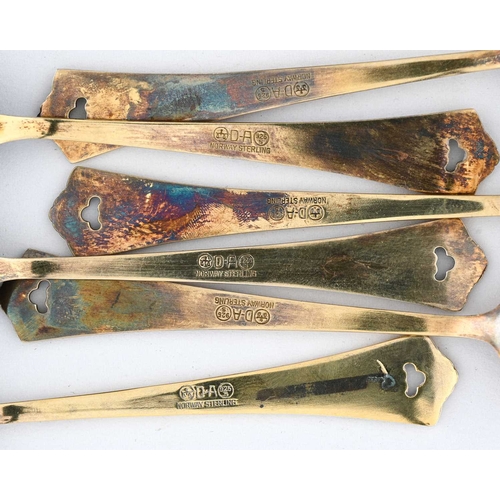 134 - David Anderson, a Harlequin set of six silver gilt and enamelled coffee spoons, cast with foliate co... 