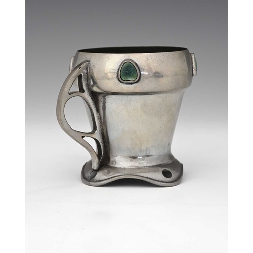 163 - Celtic Pewter, an Arts and Crafts pewter and Ruskin cabochon set mug, conical acorn form with heart ... 