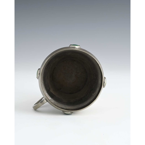 163 - Celtic Pewter, an Arts and Crafts pewter and Ruskin cabochon set mug, conical acorn form with heart ... 