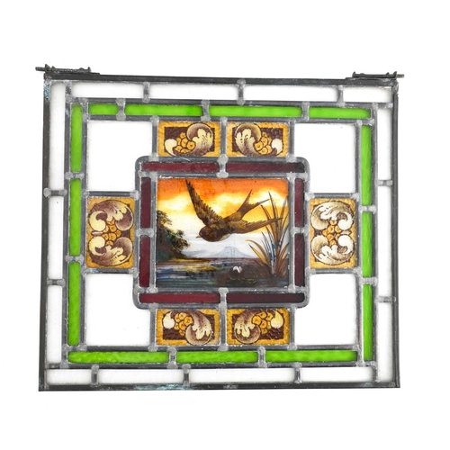 183 - A matched pair of Aesthetic Movement stained glass leaded window panels, the central light painted w... 