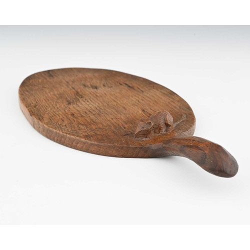 213 - Robert Mouseman Thompson (British, 1876-1955), an adzed oak cheese board, of typical form, carved mo... 