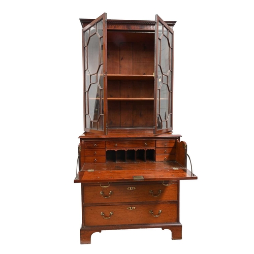 384 - A George III mahogany secretaire bookcase, circa 1800, dentil cornice, twin geometric astragal glaze... 