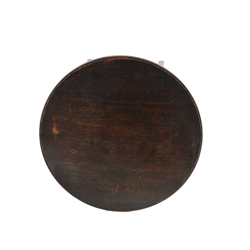 390 - Liberty and Co., an Arts and Crafts oak occasional table, circa 1900, the circular top on splayed an... 