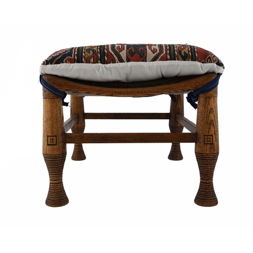 391 - Liberty and Co., an Aesthetic Movement oak Thebes stool, turned and incised legs united by stretcher... 