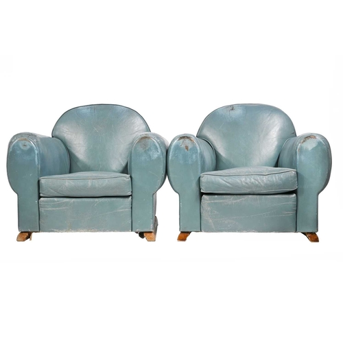 395 - A pair of Art Deco club armchairs, 1930s, sky blue leather upholstery, curved backs, deep slouched s... 