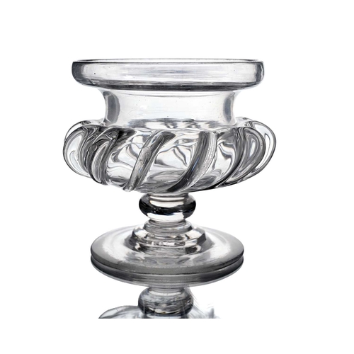 412 - An Anglo Irish pedestal glass compote, circa 1800, of Campana urn form with wrythen pincered fin lik... 