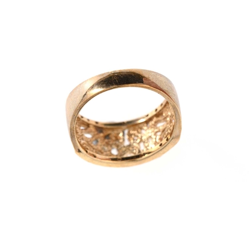 7 - A 9ct gold diamond accent openwork ring