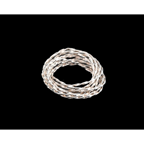 76 - Professor Yasuki Hiramatsu, a silver twisted wire ring, approximate ring size between S and U, weigh... 