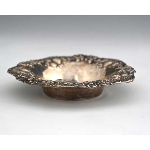 99 - An American sterling silver trinket dish, Woodside Sterling Co., circa 1900, embossed with bunches o... 