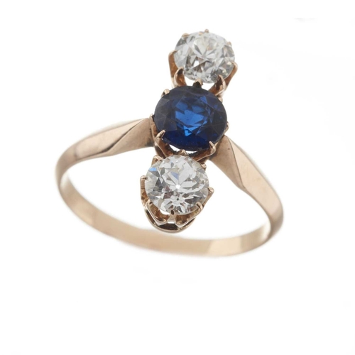 32 - An early 20th century gold synthetic sapphire and old-cut diamond three-stone ring, with tapered sho... 