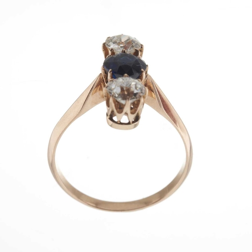 32 - An early 20th century gold synthetic sapphire and old-cut diamond three-stone ring, with tapered sho... 