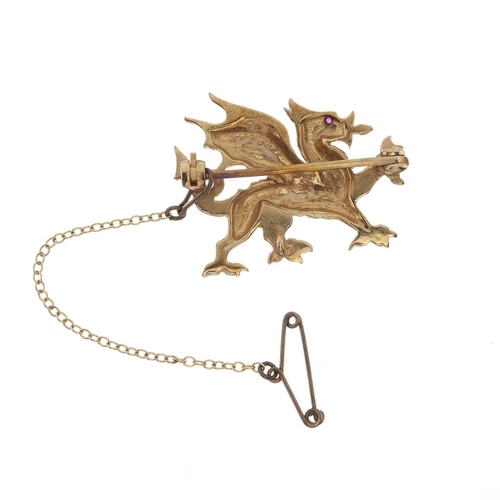 46 - A 9ct gold Welsh dragon brooch, with red gem eye, hallmarks for Birmingham 1999, length 3.2cm, 7.5g