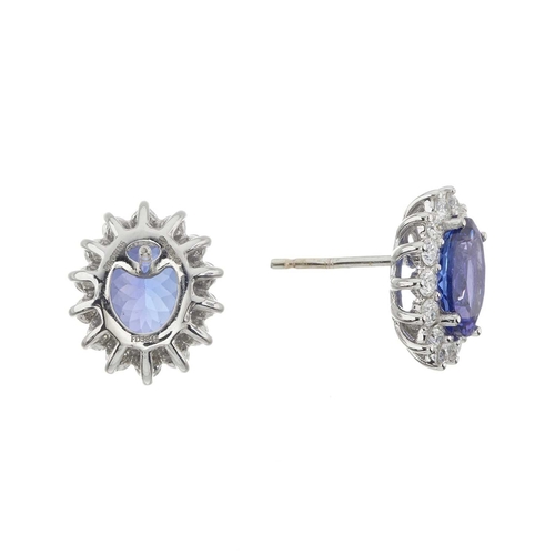 60 - A pair of 18ct gold tanzanite and brilliant-cut diamond cluster stud earrings, estimated total tanza... 