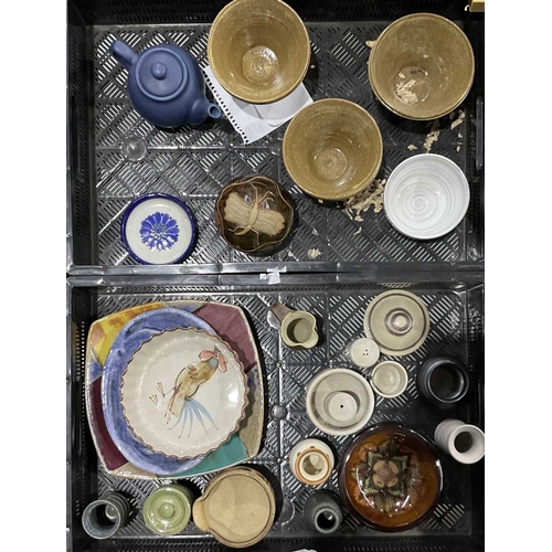 91 - A selection of studio pottery vessels to include a set of oriental stoneware bowls with makers mark,... 