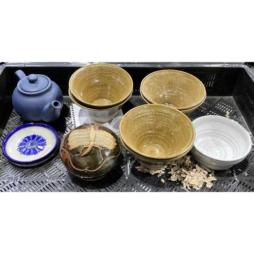 91 - A selection of studio pottery vessels to include a set of oriental stoneware bowls with makers mark,... 