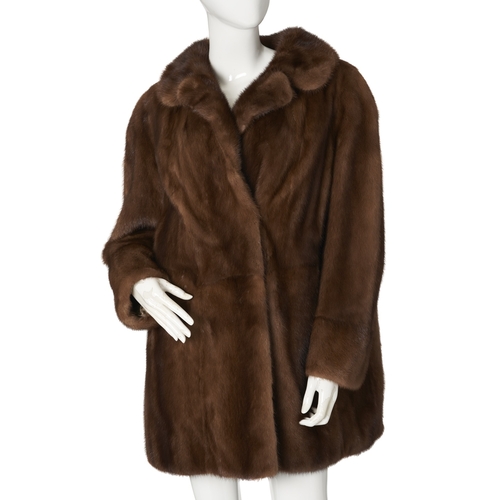532 - A demi-buff mink coat, with a notched lapel collar, hook and eye clip fastenings and two outer pocke... 