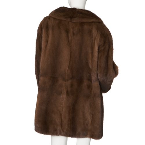 532 - A demi-buff mink coat, with a notched lapel collar, hook and eye clip fastenings and two outer pocke... 