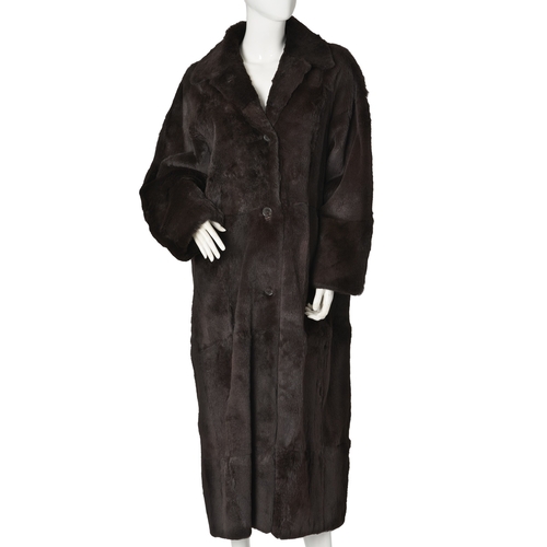 534 - Max, a full-length sheared coney coat, with a notched lapel collar, front button fastenings and two ... 