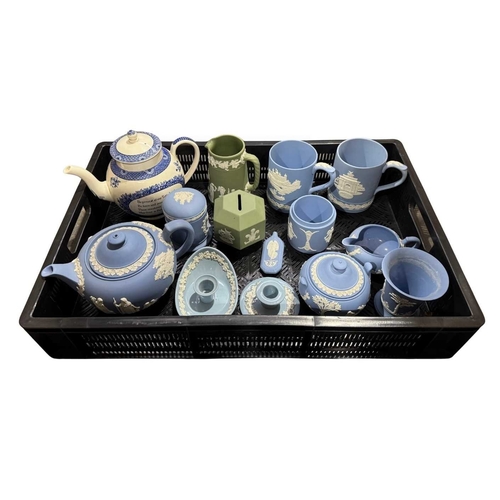 128 - A collection of Wedgwood jasperware to include a teapot, a green hexagonal money box to celebrate th... 