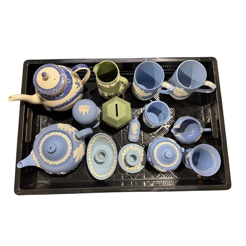 128 - A collection of Wedgwood jasperware to include a teapot, a green hexagonal money box to celebrate th... 