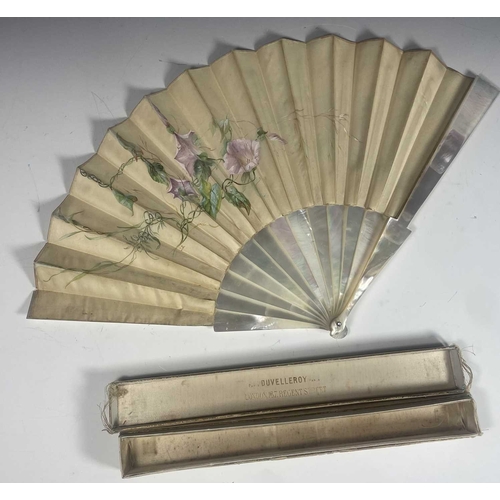 381 - An Edwardian mother of pearl and silk, painted pink convolvuus flowers and signed C Leroy in a box m... 