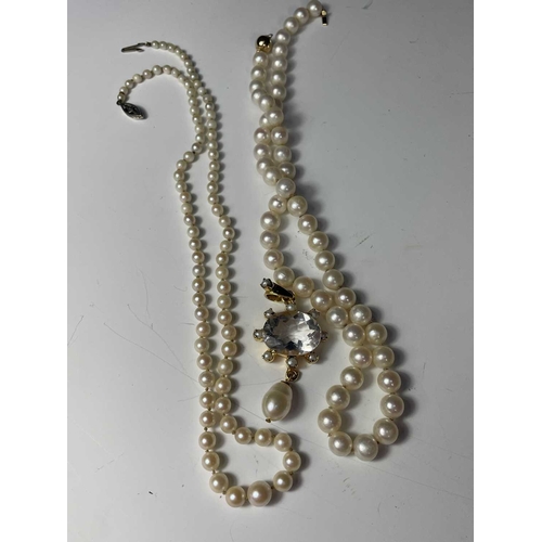 393 - A collection of costume jewellery, to include a pearl necklace and pendant of cut glass and pearl in... 