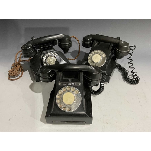 407 - Two black Bakelite 300 series rotary dial desk telephones, 1950s, one with 'Call Exchange' button, b... 
