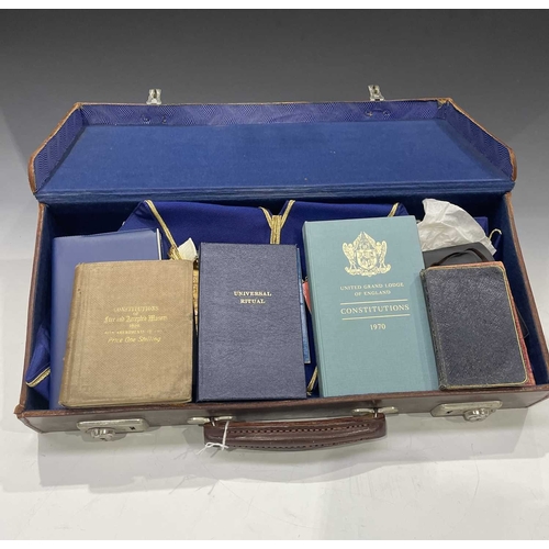 408 - A collection of British and French Masonic memorabilia and regalia, contained in a leather briefcase... 