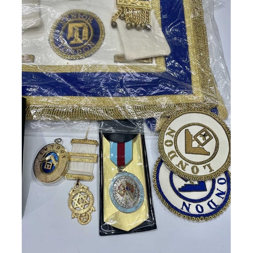 408 - A collection of British and French Masonic memorabilia and regalia, contained in a leather briefcase... 