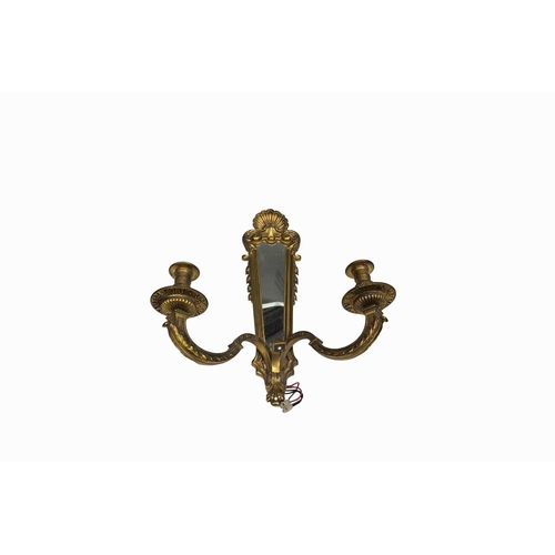 411 - A pair of 18th century style two arm brass wall lights with framed mirror back, the mirror mounted b... 