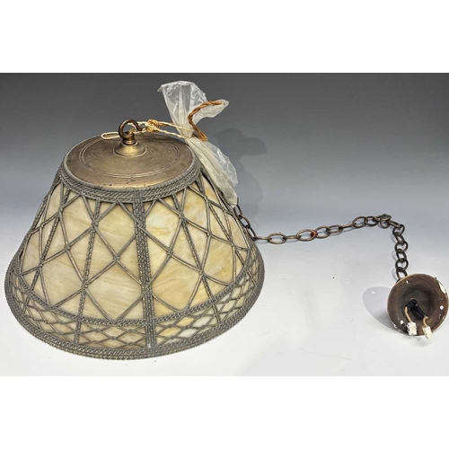413 - A ceiling pendant light, flared form, slag glass panels with brass wire overlay, 20cm high, 39cm dia... 