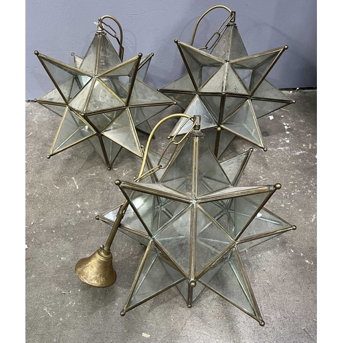 42 - Three star-form glass and brass pendant lights, h: 70cm, w: 37cm (3) Provenance: from the collection... 
